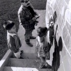 restoring the 'pan am' mural in 1996 with young assistants